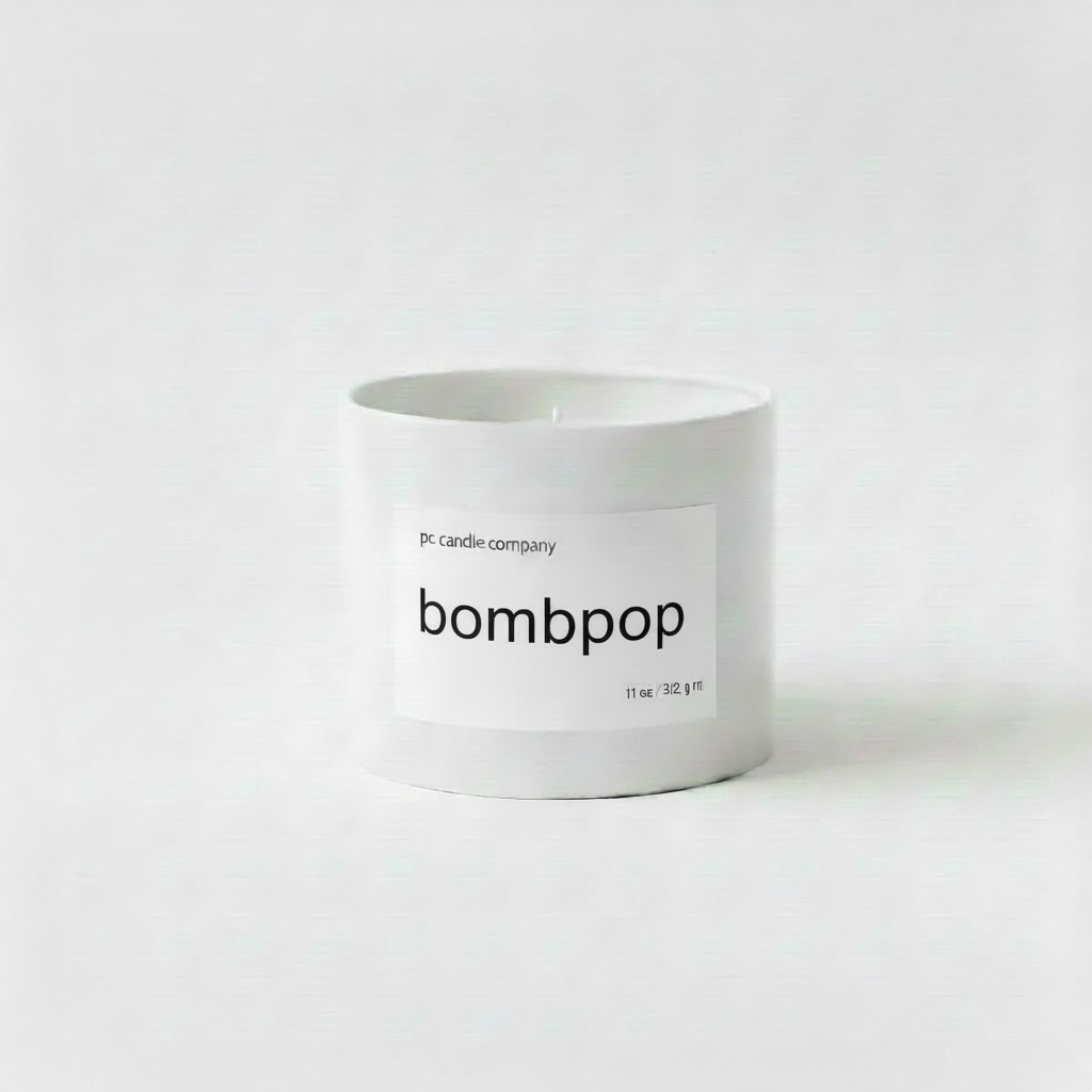 White candle tin with bombpop label