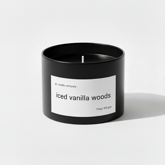 Black candle tin with iced vanilla woods label