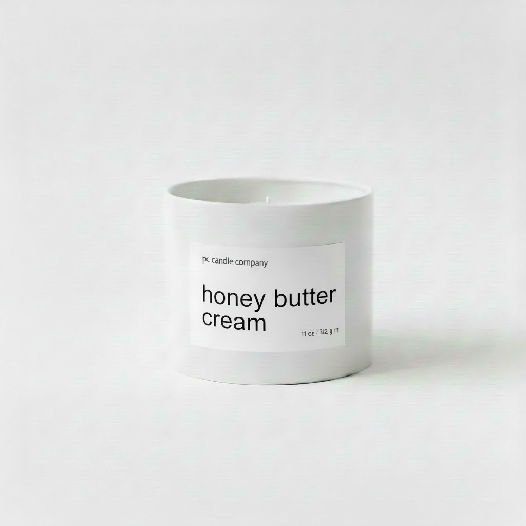 White candle tin with honey butter cream label