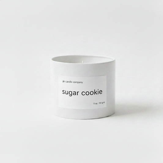 White candle tin with sugar cookie label