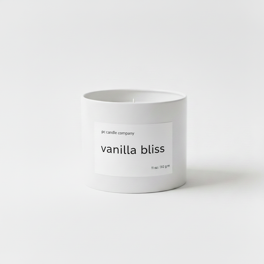 White candle tin with vanilla bliss label